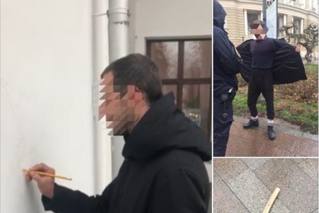 Возле Думской площади хулиган расписывал стены зданий и угрожал прохожим топором (фото)