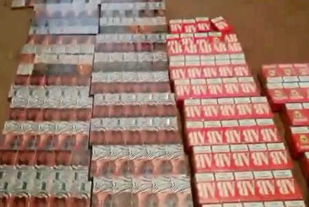 В частных домах Раздельнянского района нашли 15 тысяч пачек сигарет и более 250 литров нелегального алкоголя (фото, видео)
